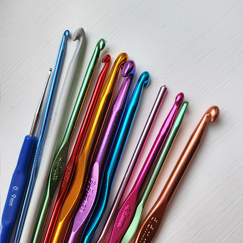 Crochet newbie supplies - Metal crochet hooks in various sizes.