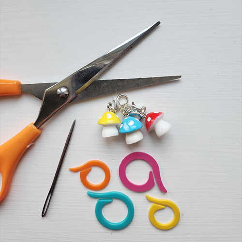 Crochet newbie supplies, - Scissors, darning needle and stitch markers.